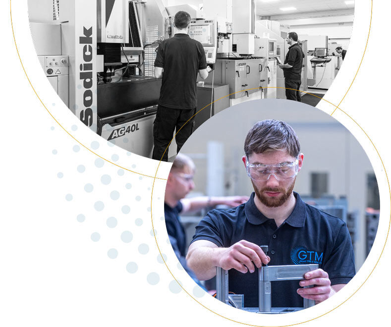 The GTM team operating moulding machinery